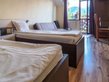    - Double room with 2 beds and balcony